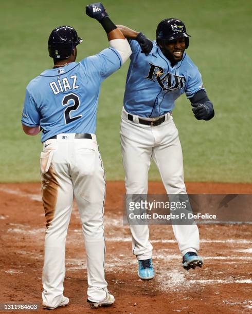 Randy Arozarena of the Tampa Bay Rays celebrates with Yandy Díaz after hitting a two-run home run during the third inning against the New York...