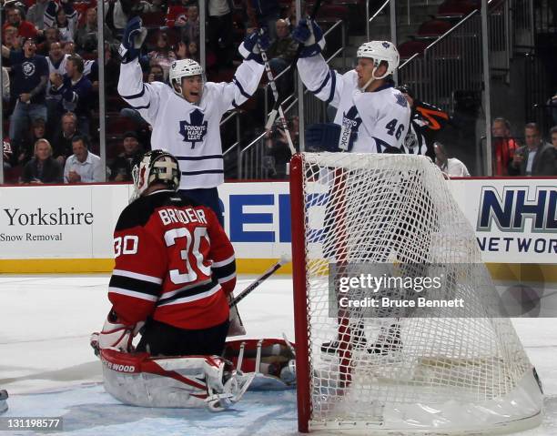 Tyler Bozak celebrates a score by Joey Crabb of the Toronto Maple Leafs at 8:37 of the first period against Martin Brodeur of the New Jersey Devils...