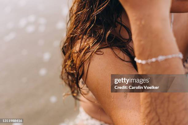 close up of wet hair of a female on the beach - leopard print stock pictures, royalty-free photos & images