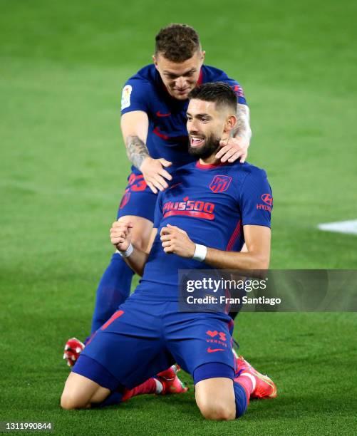 Yannick Carrasco of Atletico de Madrid celebrates with Kieran Trippier after scoring their side's first goal during the La Liga Santander match...