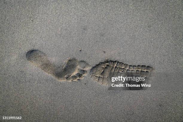 foot print in the sand - shoe print stock pictures, royalty-free photos & images