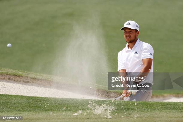Xander Schauffele of the United States plays a shot from a bunker on the second hole during the final round of the Masters at Augusta National Golf...