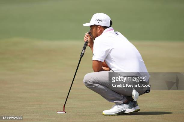 Xander Schauffele of the United States looks over his putt on the second green during the final round of the Masters at Augusta National Golf Club on...