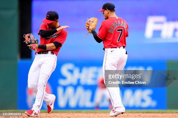 Andres Gimenez and Cesar Hernandez of the Cleveland Indians react to their 5-2 win over the Detroit Tigers during a game at Progressive Field on...