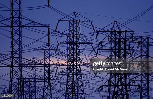 View of the power lines as evening settles December 11, 2000 in Pico Rivera, CA. California residents statewide are urged to delay turning on their...