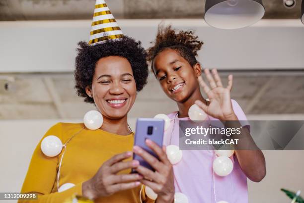 online birthday celebration via mobile phone video call - zoom birthday stock pictures, royalty-free photos & images