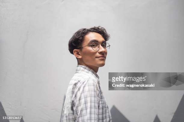 portrait of non binary person - testimonial portrait smile stock pictures, royalty-free photos & images