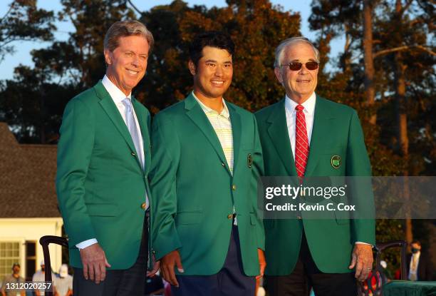 Hideki Matsuyama of Japan poses for a photo with Fred Ridley, Chairman of Augusta National Golf Club, and Billy Payne, former chairman of Augusta...