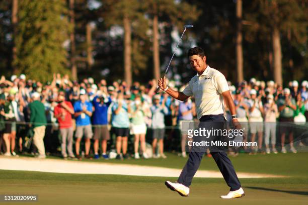 Hideki Matsuyama of Japan celebrates on the 18th green after winning the Masters at Augusta National Golf Club on April 11, 2021 in Augusta, Georgia.