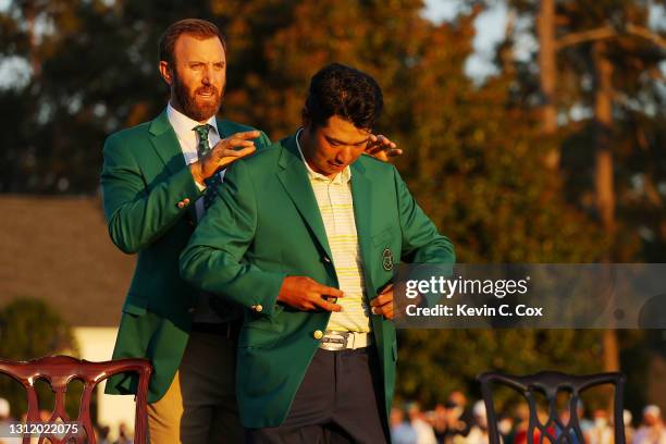 Hideki Matsuyama of Japan is awarded the Green Jacket by 2020 Masters champion Dustin Johnson of the United States during the Green Jacket Ceremony...