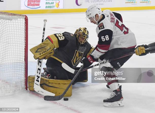 Marc-Andre Fleury of the Vegas Golden Knights blocks a shot by Michael Bunting of the Arizona Coyotes in the second period of their game at T-Mobile...