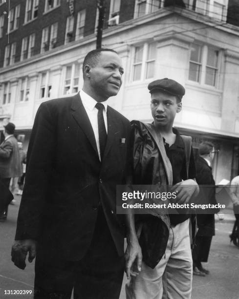 View of American newspaper publisher John H. Sengstacke and his son Lewis during on the Selma to Montgomery marches held in support of voter rights,...