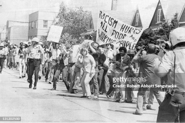 Anti-racism demonstrators line the streets as they protest a potential neo-Nazi march, Skokie, Illinois, 1977 or 1978.