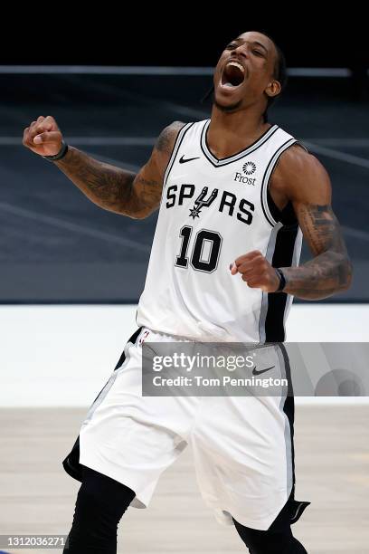 DeMar DeRozan of the San Antonio Spurs celebrates after hitting the game-winning shot against the Dallas Mavericks in the final second of the game at...