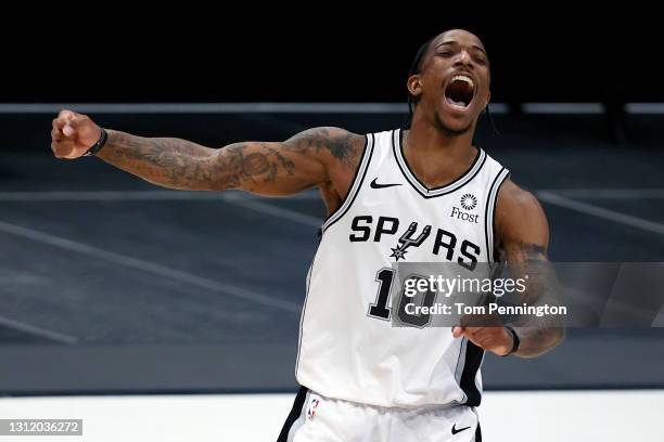 DeMar DeRozan of the San Antonio Spurs celebrates after hitting the game-winning shot against the Dallas Mavericks in the final second of the game at...