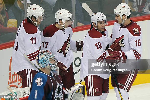 Radim Vrbata of the Phoenix Coyotes celebrates his second period goal against goalie Semyon Varlamov of the Colorado Avalanche with teammates Martin...