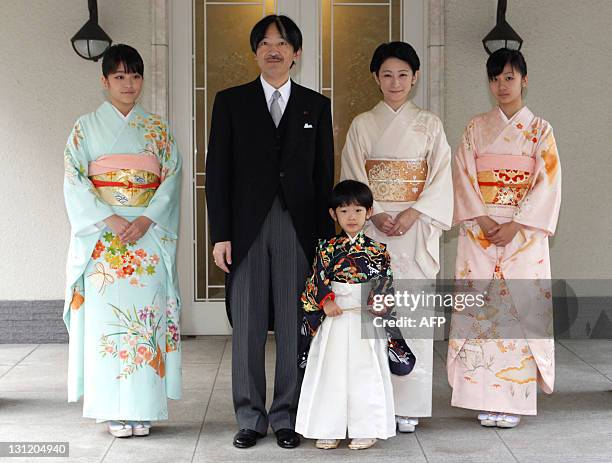 Japan's Prince Hisahito wearing traditional ceremonial attire is accompanied by his father Prince Akishino , mother Princess Kiko and sisters...