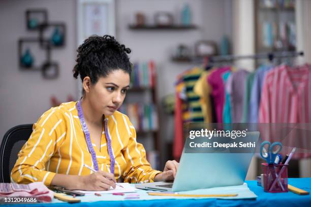 shot of a young women as a fashion designer using laptop, stock photo - fashion designer stock pictures, royalty-free photos & images