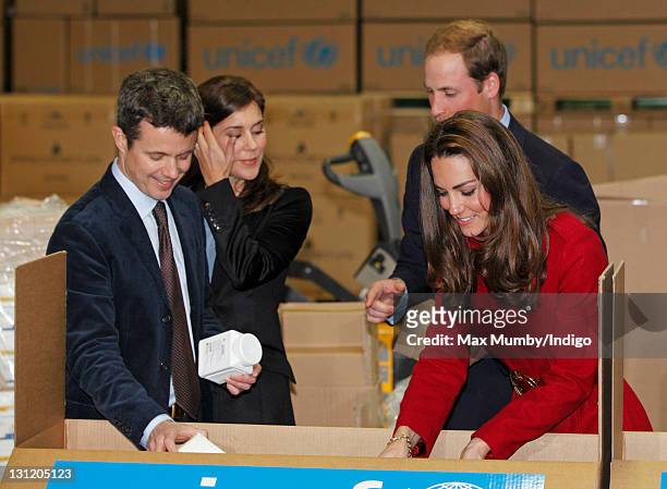Crown Prince Frederik of Denmark , Crown Princess Mary of Denmark , Prince William, Duke of Cambridge and Catherine, Duchess of Cambridge help to...