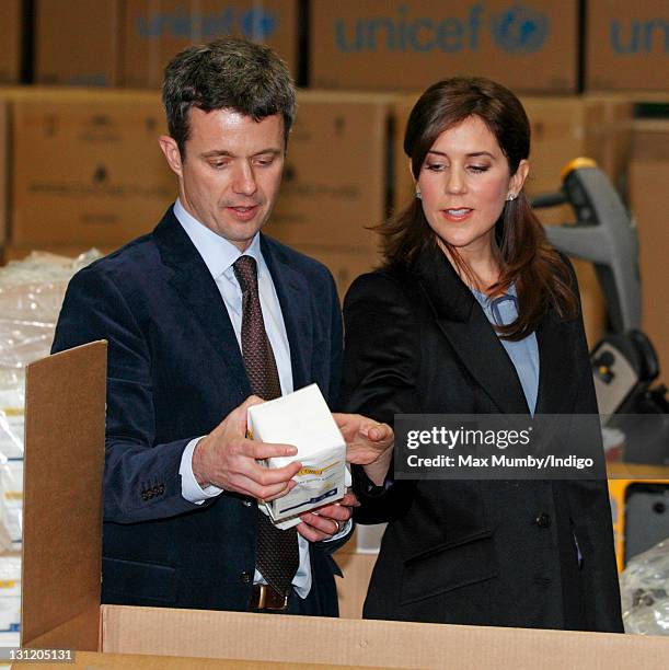 Crown Prince Frederik of Denmark and Crown Princess Mary of Denmark help to pack relief boxes as they visit the UNICEF emergency supply centre on...