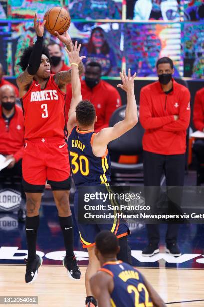 Houston Rockets guard Kevin Porter Jr. Scores against Golden State Warriors guard Stephen Curry in the first quarter of an NBA game at Chase Center,...