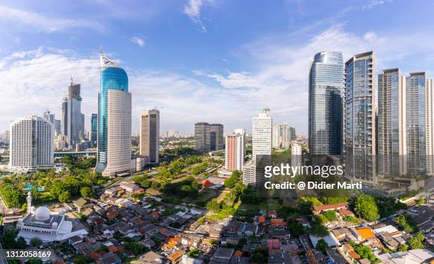 aerial panorama of the modern jakarta downtown and business district in indonesia capital city - 新興国 ストックフォトと画像