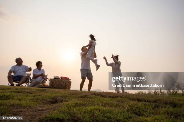 asian family picnic and camping. they relax and feeling happy - asian family camping stock pictures, royalty-free photos & images