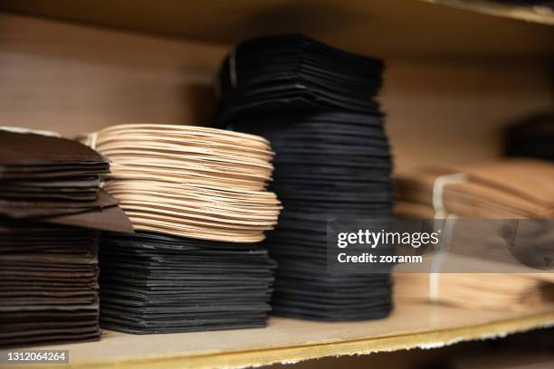 shoe repairing material on a shelf in workshop - insoles stock pictures, royalty-free photos & images