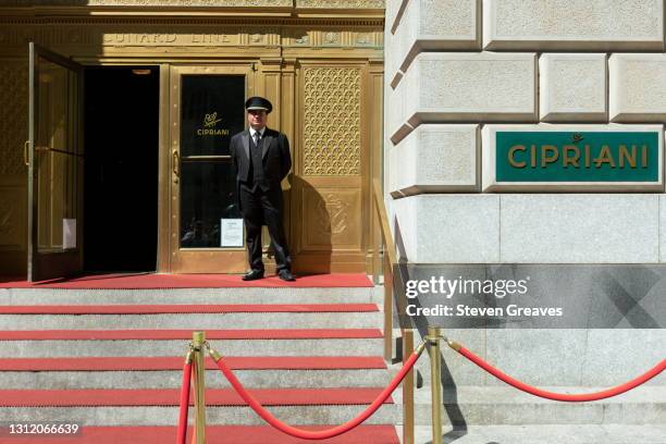 doorman and facade of cipriani - cipriani manhattan stock pictures, royalty-free photos & images
