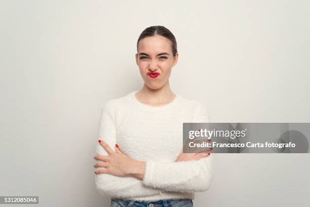 hispanic young woman making a face - hair back stock pictures, royalty-free photos & images