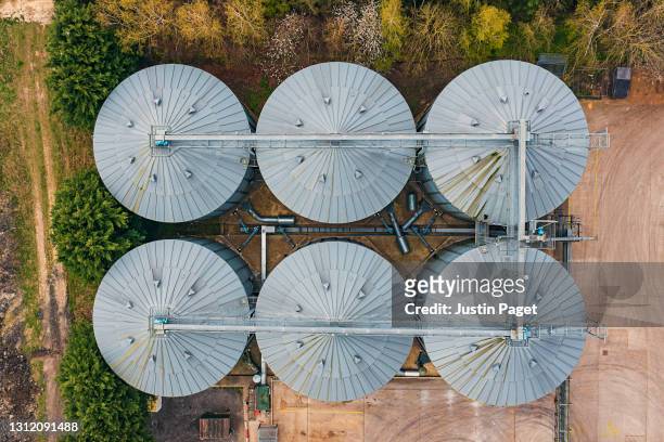 drone view onto agricultural stores - granary stock pictures, royalty-free photos & images