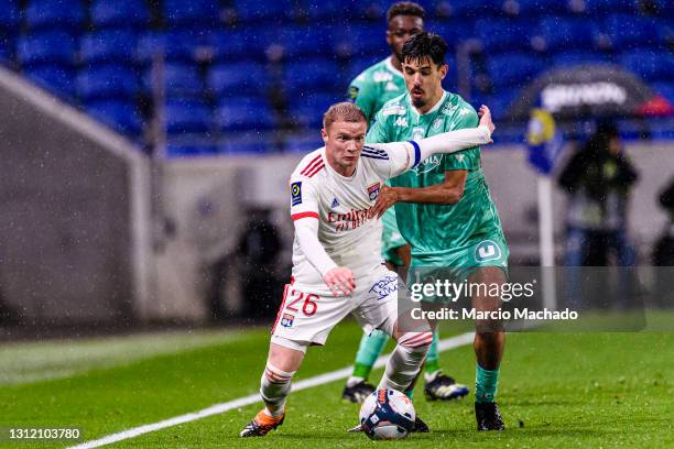 Zinedine Khaled of Angers fights for the ball with Melvin Bard of Olympique Lyon during the Ligue 1 match between Olympique Lyon and Angers SCO at...