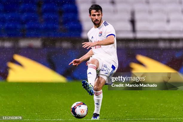 Leo Dubois of Olympique Lyon passes the ball during the Ligue 1 match between Olympique Lyon and Angers SCO at Groupama Stadium on April 11, 2021 in...