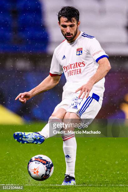 Leo Dubois of Olympique Lyon passes the ball during the Ligue 1 match between Olympique Lyon and Angers SCO at Groupama Stadium on April 11, 2021 in...