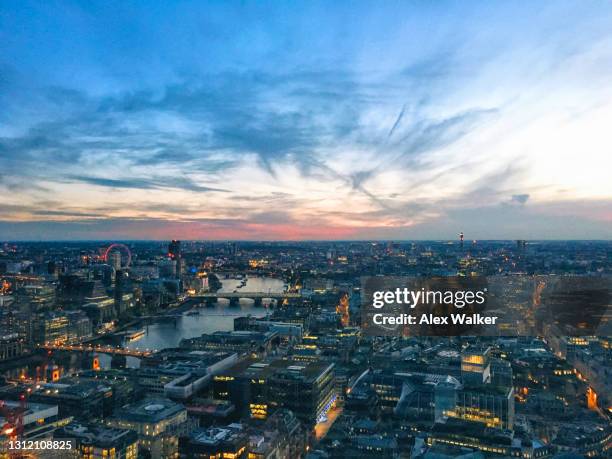 london skyline at dusk with dramatic cloudscape - bt tower stock-fotos und bilder