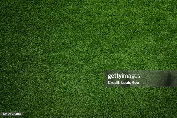 green grass background - kunstgras stockfoto's en -beelden