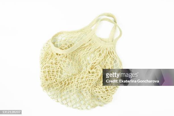 eco-friendly beige cotton mesh bag for food on white insulated background. - reusable bag isolated stock pictures, royalty-free photos & images