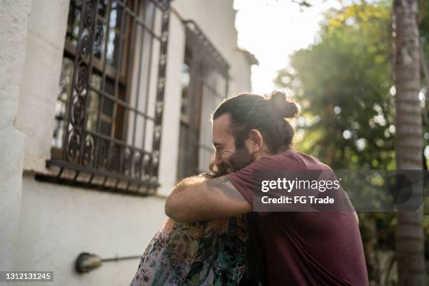 couple embracing outdoors - apology stock pictures, royalty-free photos & images