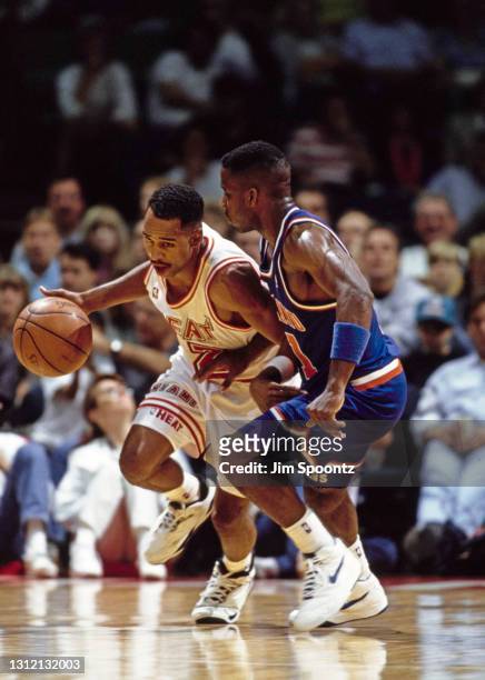 Keith Askins, Small Forward for the Miami Heat dribbles the basketball around Terrell Brandon of the Cleveland Cavaliers during their NBA Atlantic...