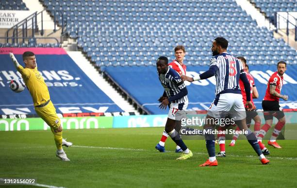 Mbaye Diagne of West Bromwich Albion scores their sides first goal past Fraser Forster of Southampton which is later disallowed by VAR during the...