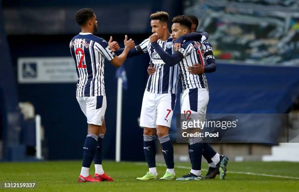 Matheus Pereira of West Bromwich Albion celebrates after scoring their sides first goal with team mates Darnell Furlong, Callum Robinson and Ainsley...