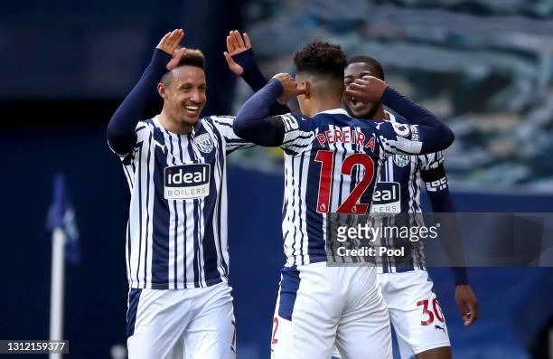 Matheus Pereira of West Bromwich Albion celebrates after scoring their sides first goal with team mates Callum Robinson and Ainsley Maitland-Niles of...