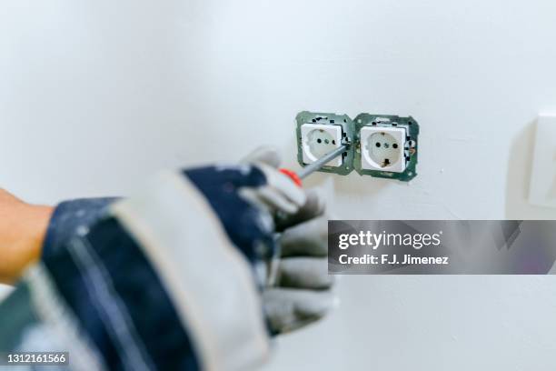 Putting Plug In Socket Under Construction Photos and Premium High Res Pictures - Getty ...