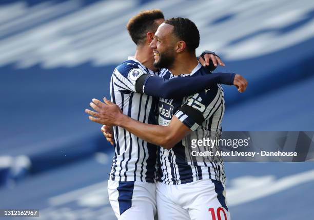 Matt Phillips of West Bromwich Albion celebrates with Callum Robinson after scoring their second goal during the Premier League match between West...