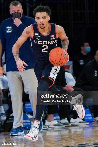 James Bouknight of the Connecticut Huskies dribbles the ball against the Creighton Bluejays during a Big East Tournament semifinal game at Madison...