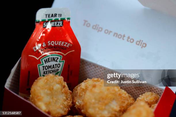 Packet of Heinz ketchup is displayed with Chick-fil-A hash browns on April 12, 2021 in Novato, California. Packets of ketchup are in short supply as...