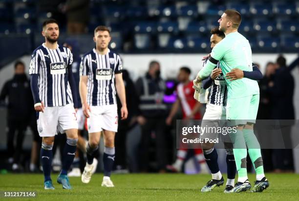 Matheus Pereira and Sam Johnstone of West Bromwich Albion interact following the Premier League match between West Bromwich Albion and Southampton at...