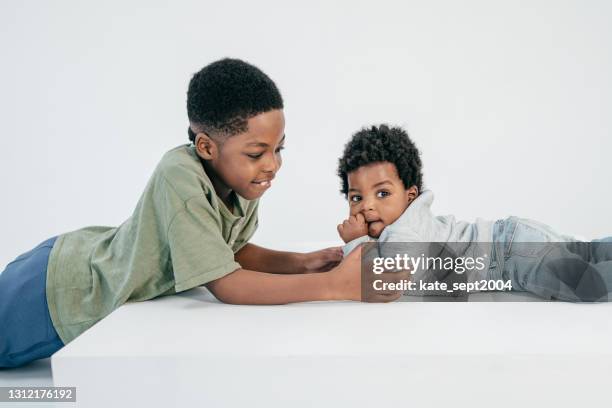Small Brother Boy With Little Brother High-Res Stock Photo - Getty Images