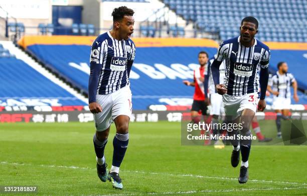 Matheus Pereira of West Bromwich Albion celebrates after scoring their sides first goal with team mate Ainsley Maitland-Niles during the Premier...