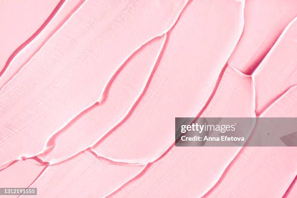 smears of gel on pastel pink background. modern abstract pattern. flat lay style and close-up - make up background stock pictures, royalty-free photos & images